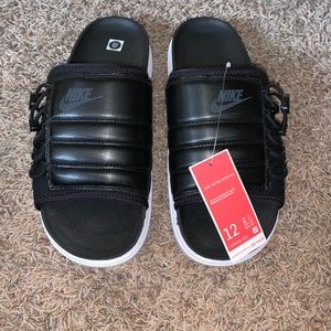 New with tags, size 12 men’s NIKE ASUNA SLIDE NA